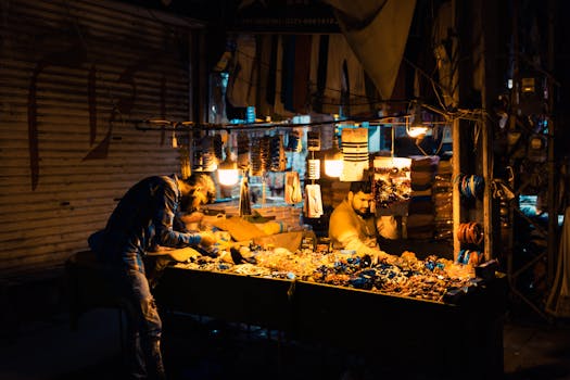 Captivating scene of a bustling night market in Faisalabad, offering colorful trinkets and atmosphere.